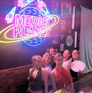 Medici Pizzeria team preparing fresh pizza in the kitchen  